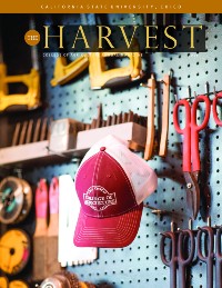 Magazine cover featuring hat and tools hanging on shop wall