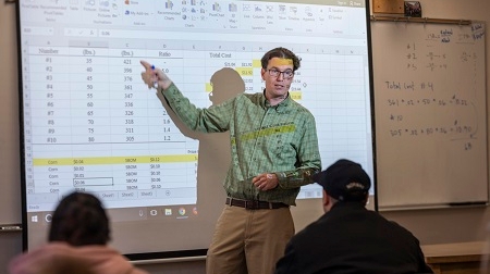 faculty member in class with students