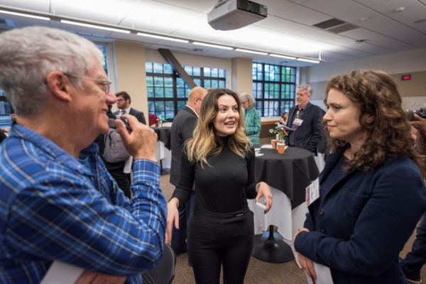 Entrepreneurship student talks to judges about her business pitch at the Pitch Party in 2017.