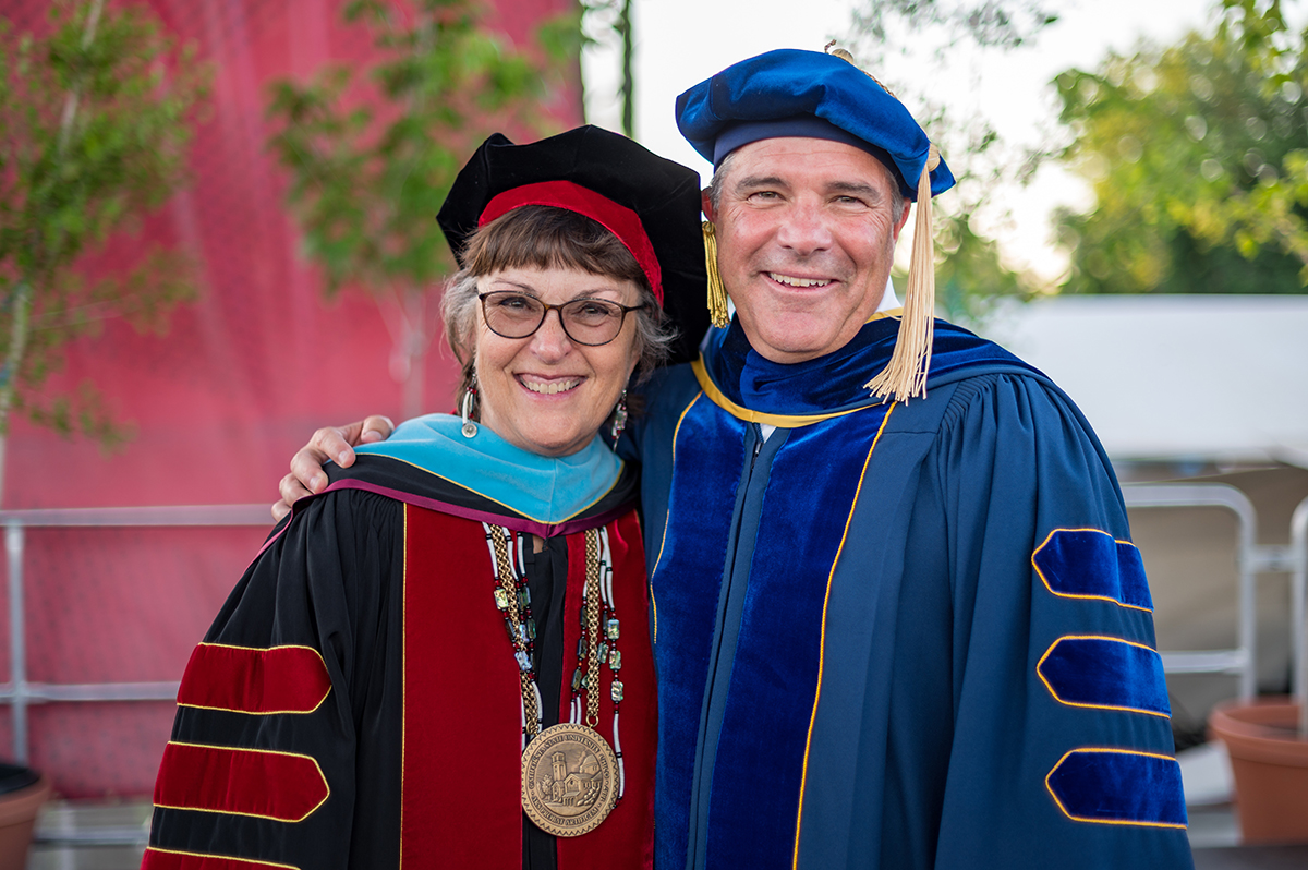 Interim Provost Perez poses with President Hutchinson at Commencement