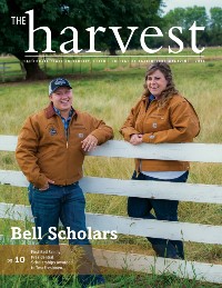 Magazine Cover featuring two students standing next to a farm fence