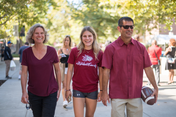 Parents and student walking on campus