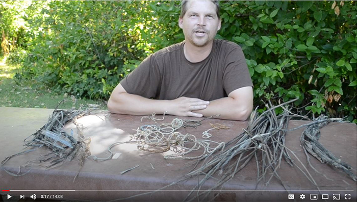 a man demonstrating how to make rope from milkweed