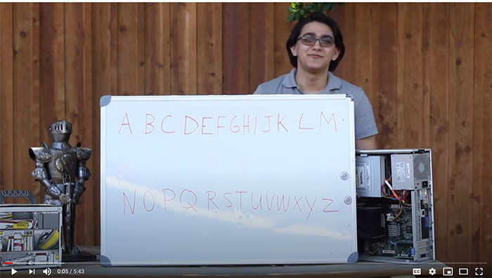 an activity outdoors that includes a whiteboard with letters on it