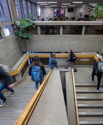 Student using library stairs