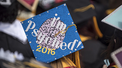 "I'm psyched!" says a Psychology student's graduation cap