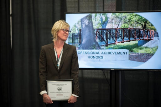 Dr. Maris Thompson Receiving Certificate for Professional Achievement Honor