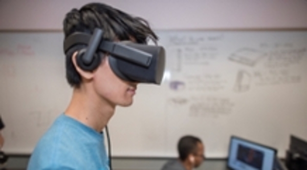 A student wears a virtual reality headset