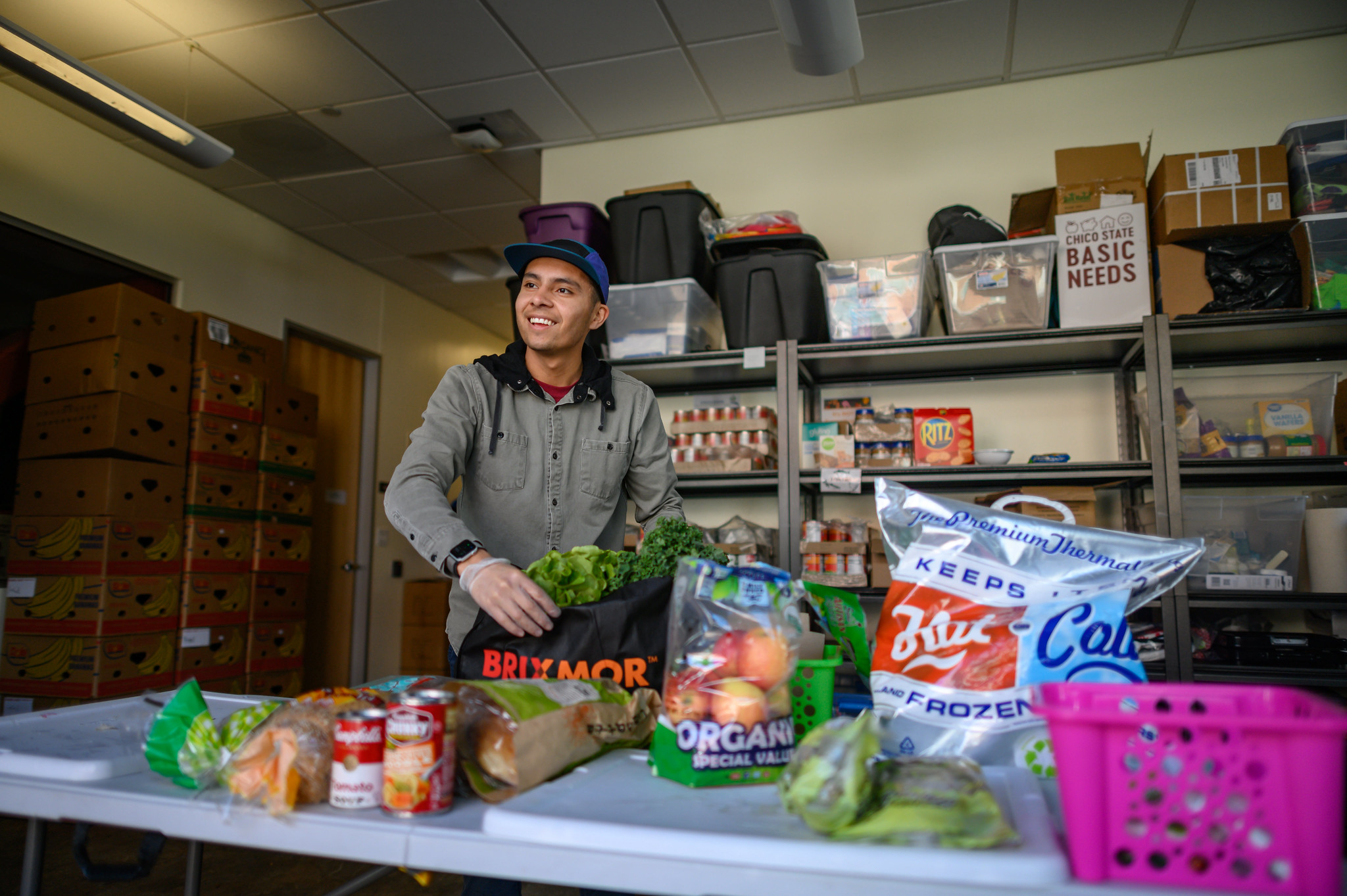 Student works in the Hungry Wildcat Food Pantry