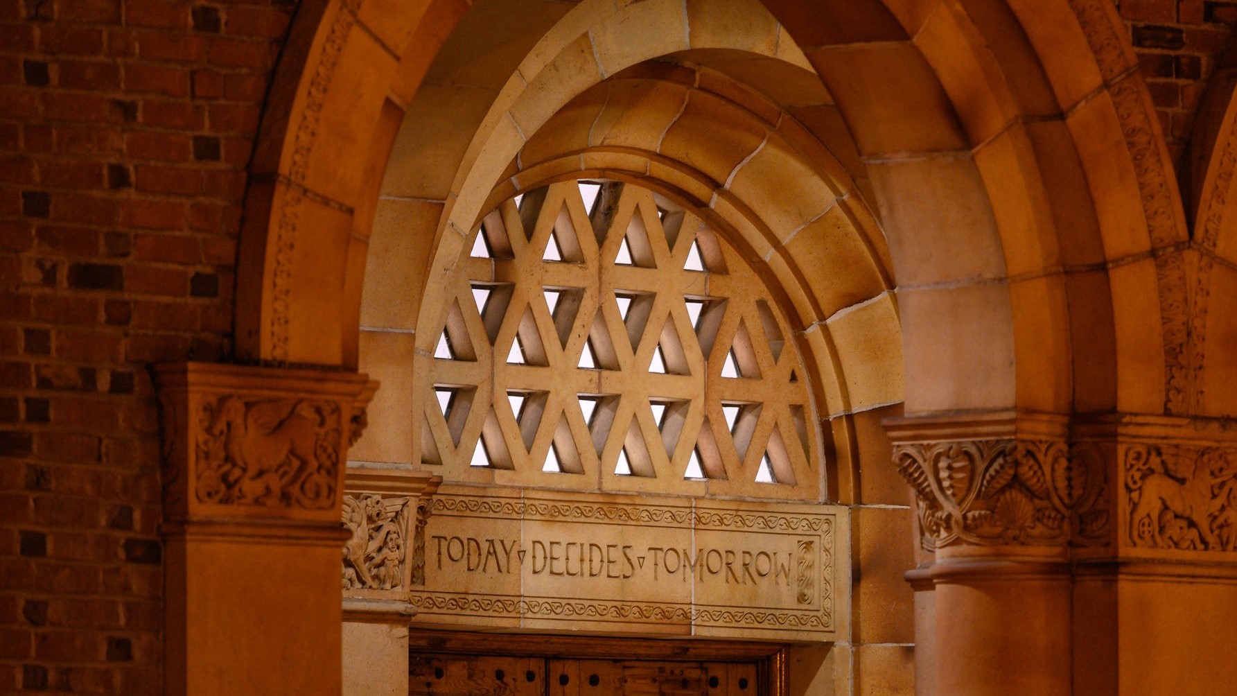 "Today Decides Tomorrow" inscribed above the main entrance to Kendall Hall