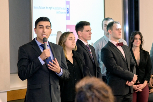 Student giving a business pitch at an entrepreneurship competition.