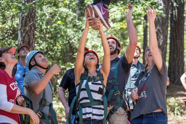 Maya Grunder (center) and other Master of Business Administration Program students test leadership skills through a ropes course as part of the MBA Leadership training event hosted by Odyssey Teams, Inc, on Friday, September 16, 2016 in Paradise, Calif.  (Jason Halley/University Photographer)