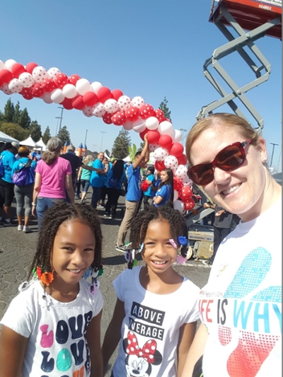 Accounting alumna Ashley Casey poses for a photo at the Stockton Heart Walk for the American Heart Association in San Joaquin County.