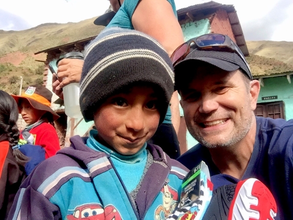 Tom Tognoli volunteering with disabled children in Peru.