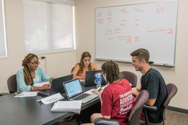 Students studying in the business student success center