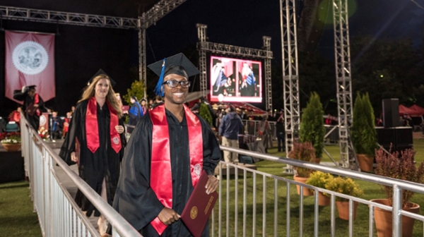 Vincent Howell (right) and other graduating students attend the 2016 Commencement Ceremony