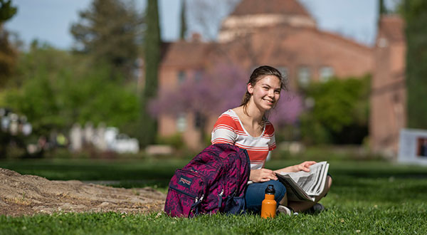 Student enjoying peaceful outside spot for studying