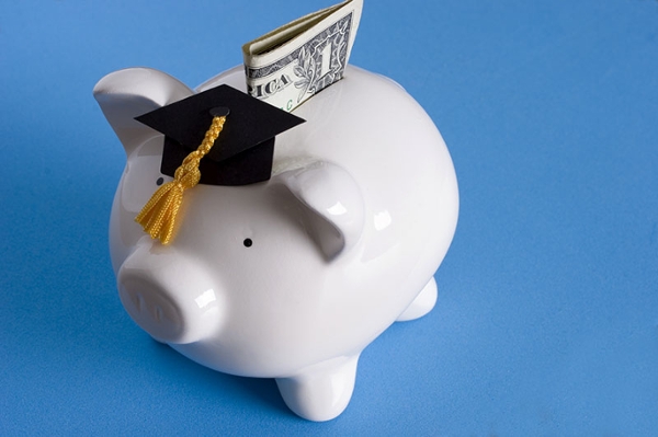 Piggy bank with a graduation hat on.
