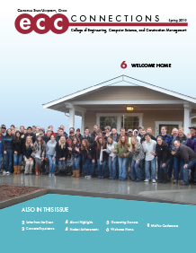 Cover shows students posing in front of house