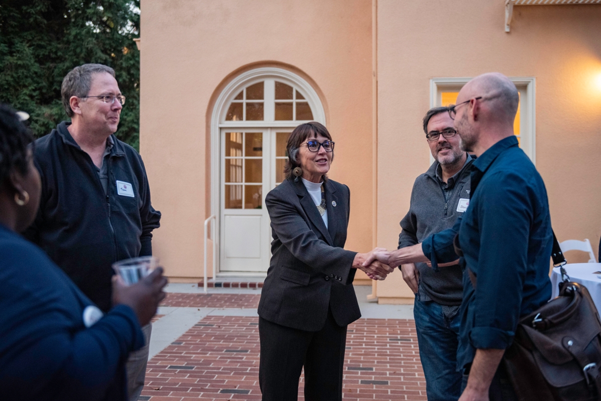 President Hutchinson shaking hands with Newly Promoted Faculty during the 2019 newly promoted faculty and tenure reception.