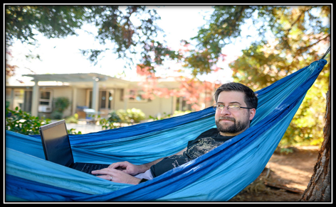 Person in a hammock with their laptop.