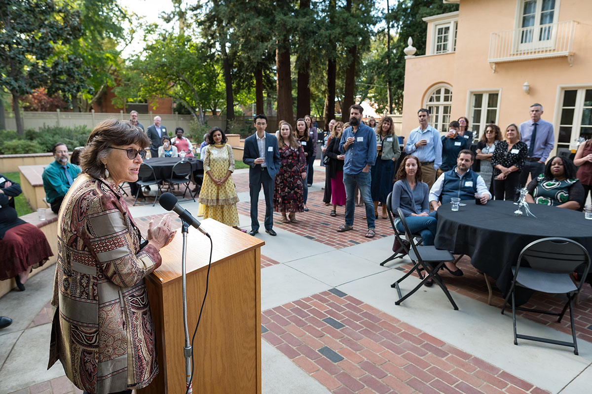 President Hutchinson speaking to crowd during the 2022 tenure and promotion faculty reception.