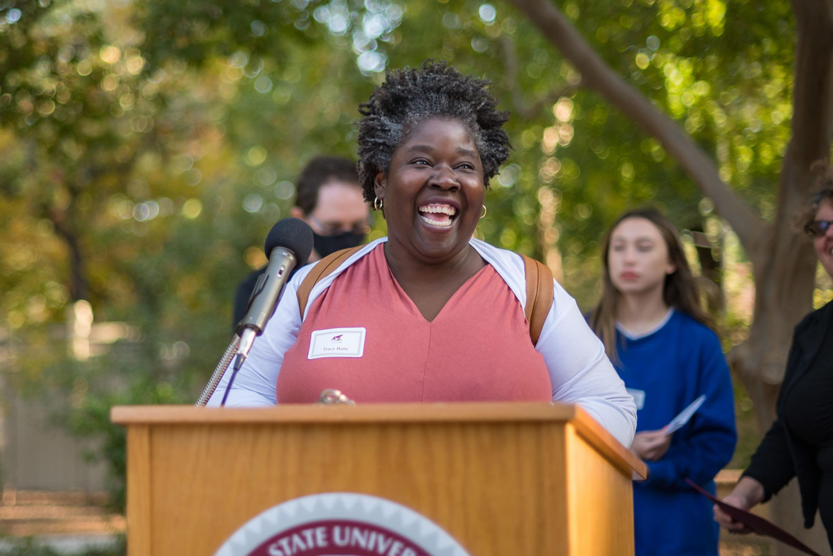 dean speaking at podium during the 2022 tenure and promotion faculty reception.