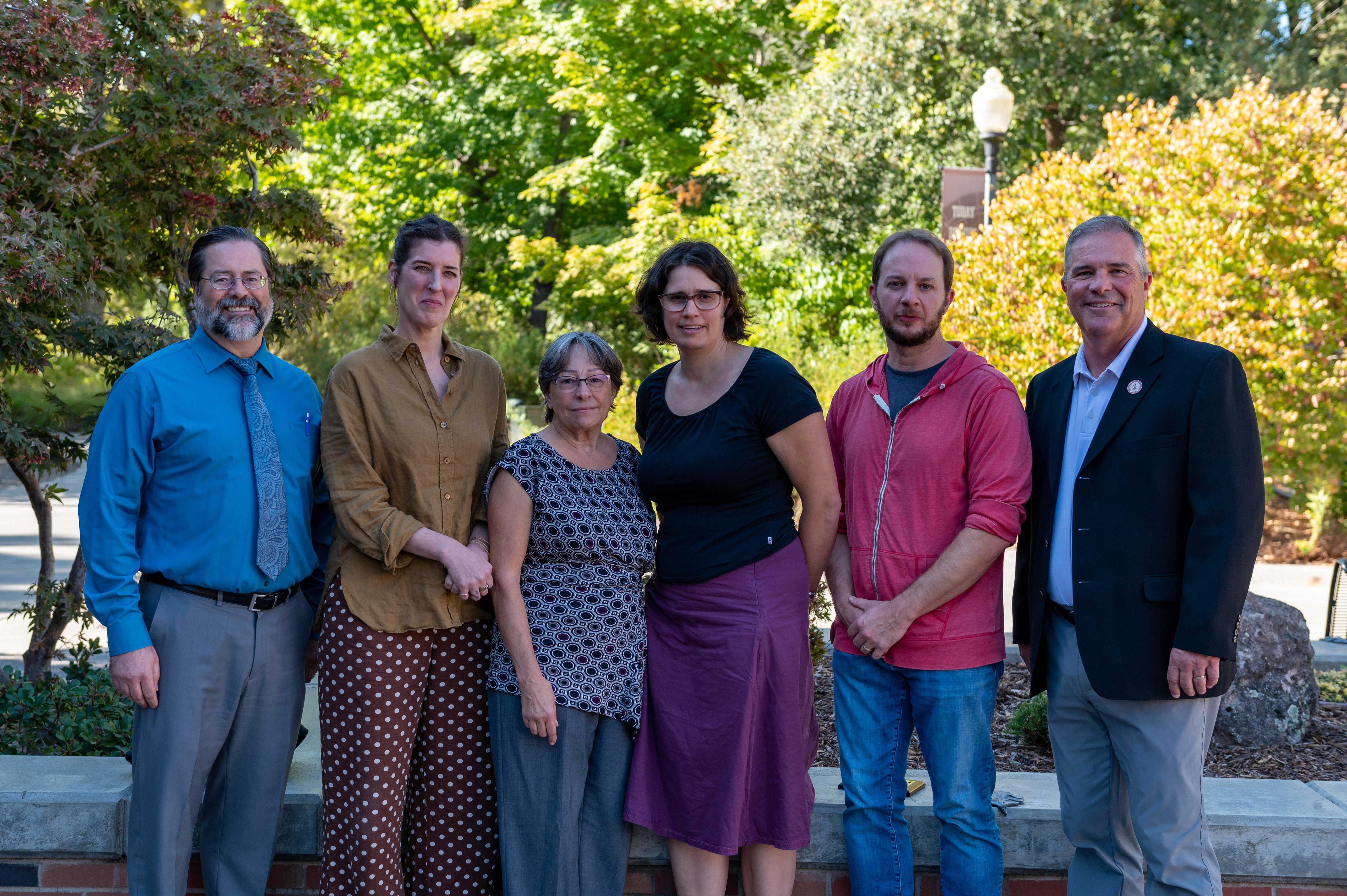Six faculty members standing next to each other