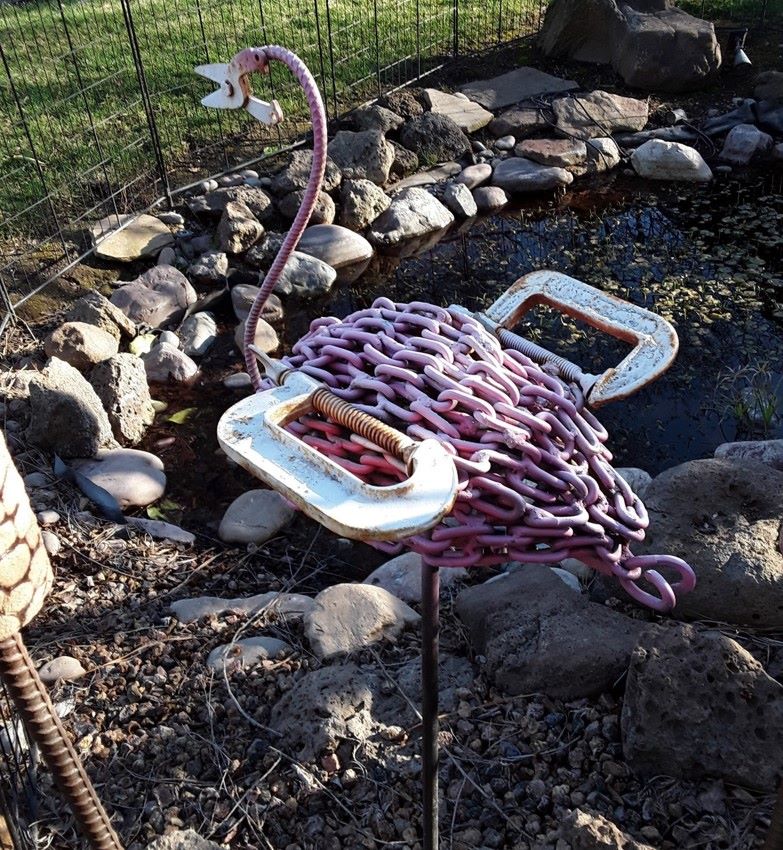 Chain and tools repurposed into a flamingo.