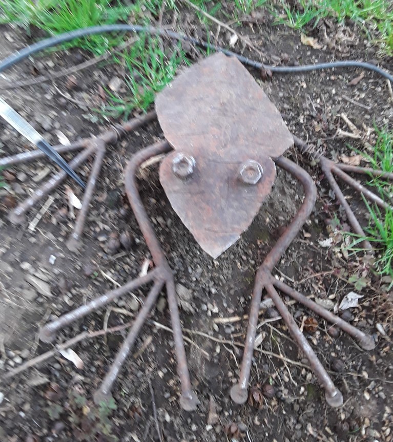 Frog made from repurposed garden tools.