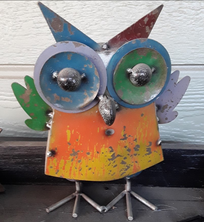 Owl made from various repurposed metal bits and pieces.