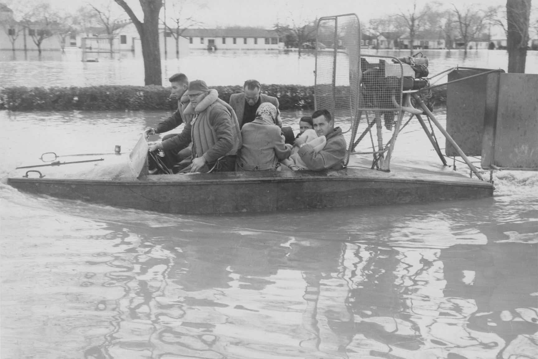 people in a boat during a flood