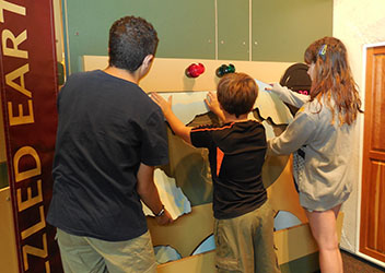 Students piece together parts of the Earth at the When the Earth Shakes exhibit