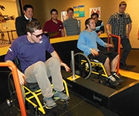 Students in wheelchairs at the Sportsology exhibit