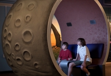 Two boys learn about asteroid encounters at the Great Balls of Fire exhibit