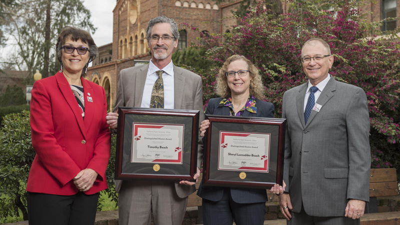 President Gayle Hutchinson, Behavioral and Social Sciences 2018 Distinguished Alumni Tim Beach (GEOG, '82) Sheryl Beach (GEOG, '82), Eddie Vela (Dean, BSS) (left to right) take a photo after the presentation of plaques on Friday, March 9, 2018 in Chico, Calif.  (Jason Halley/University Photographer/CSU Chico)