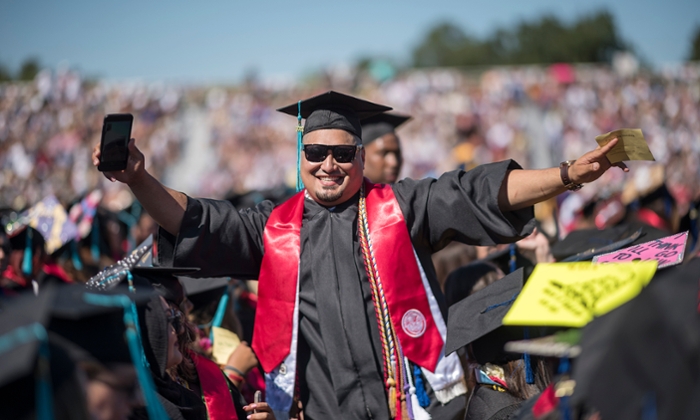 Student showing excitement at the Chico State graduation ceremony 