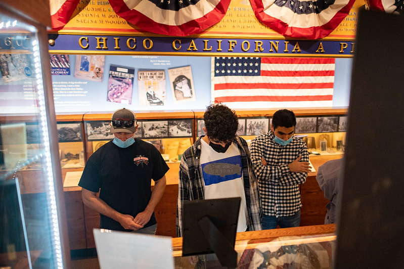 Jake Philipps, Karl Godinez, Andrew Minai (left to right) and students in Daniel Veidlinger’s Religious Studies class visit the Chico History Museum on Friday, October 15, 2021 in Chico, Calif.