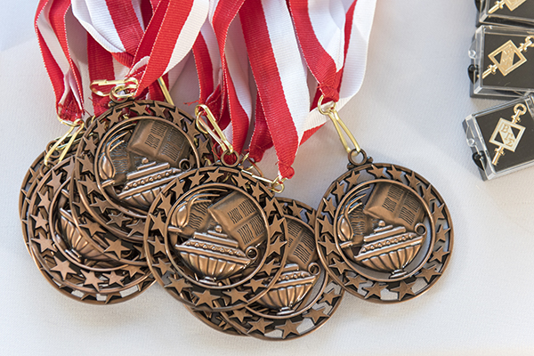 Pile of academic medals