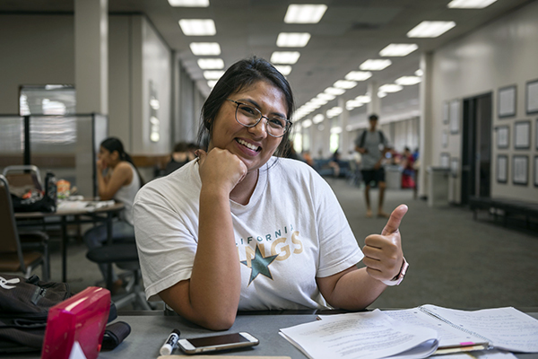 Monica Lopez Acosta, a graduate student studying in the library