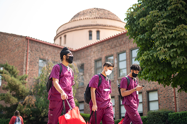 Nursing students walk across campus
