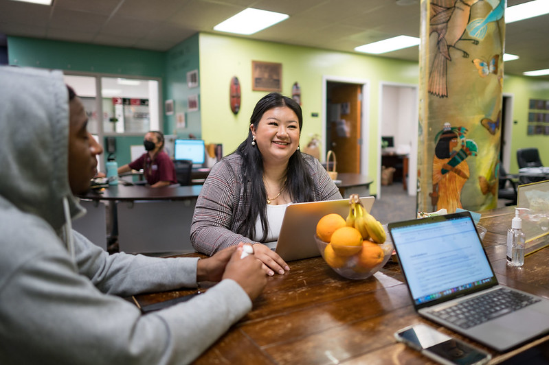 Selena Thao (center) works at the Cross-Cultural Leadership Center (CCLC) on Monday, April 25, 2022 in Chico, Calif. Thao will graduate with her Bachelor of Social Work degree and two minors in Multicultural Gender Studies and Gender and Sexualities Studies.