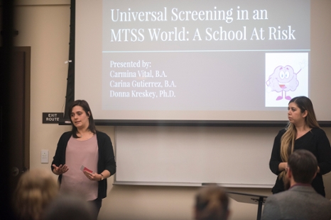 two students presenting at the Student Research Symposium