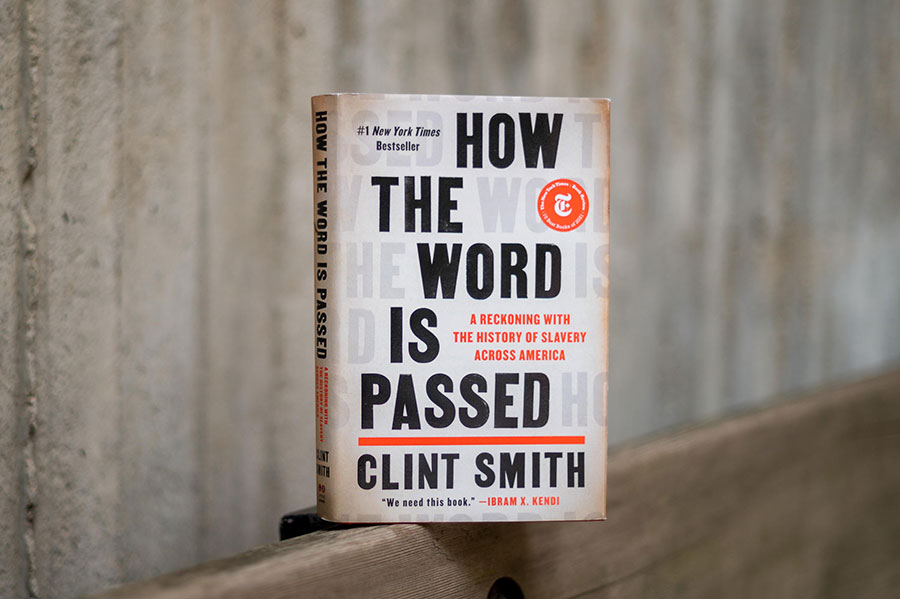 A book, titled "How the Word is Passed, sits on a ledge