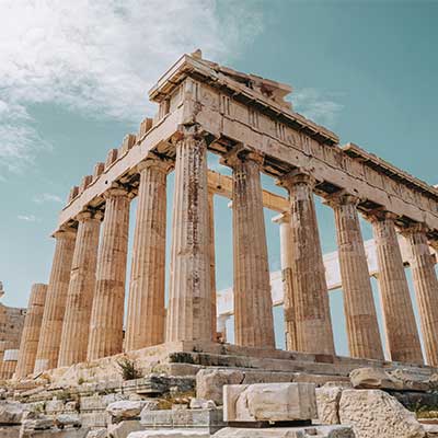 The Parthenon in Athens, Greece: A majestic ancient temple atop the Acropolis hill, showcasing Greek architectural brilliance.