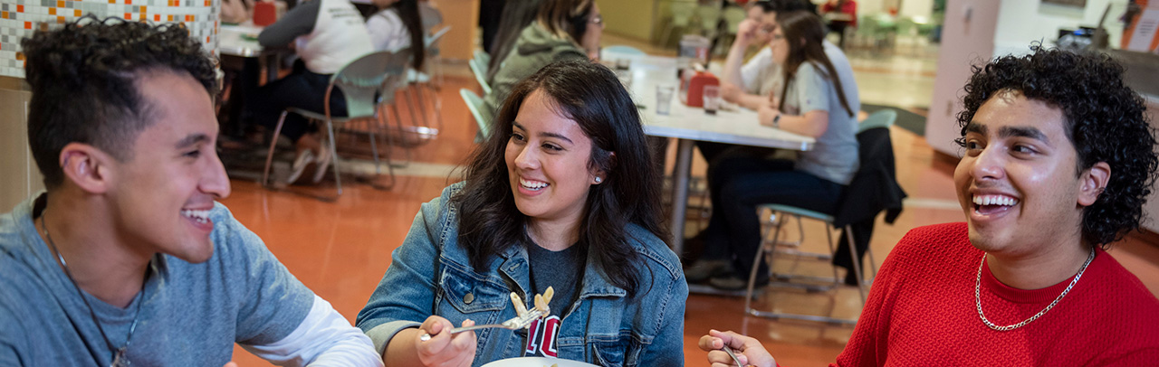 student enjoying meal within Sutter dining hall