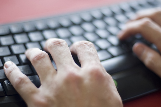 Picture of hands typing on keyboard