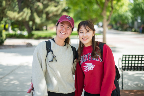 students smiling on campus