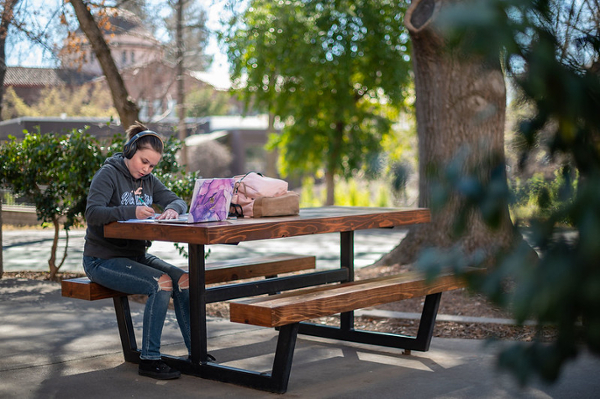 student at table outside