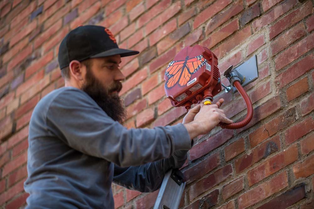 CCSV workers install wifi devices to help expand campus coverage.